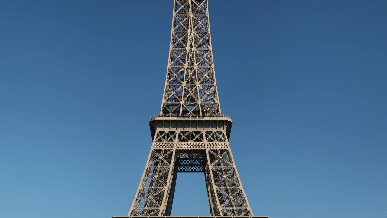 Eiffel Tower in Paris in daylight seen from the Champ de Mars — Paris trip cost 2026 guide