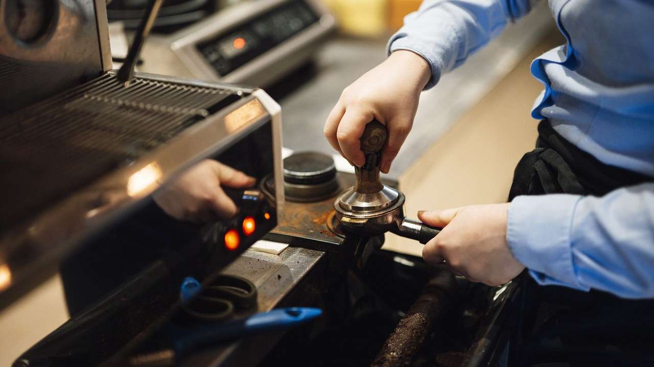 A student working a part-time café shift